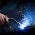 Hand-welding-AdobeStock_96493659